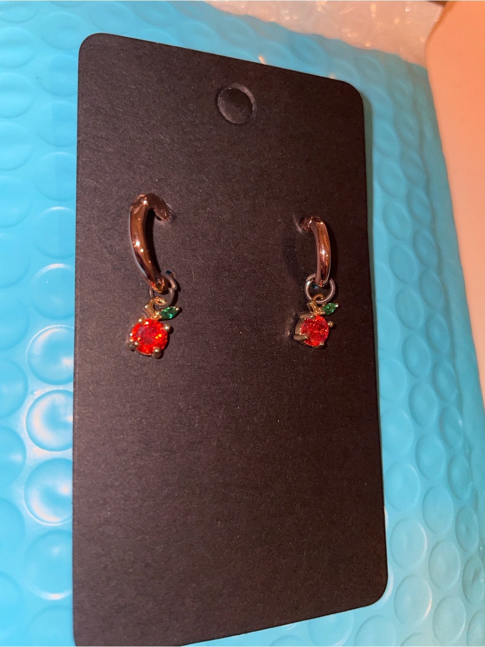 Peach Earrings on Rose Gold Huggies